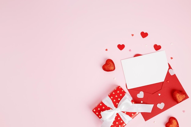 Valentine day holiday background with gift red envelope paper card and various hearts romantic message Copy space Top view