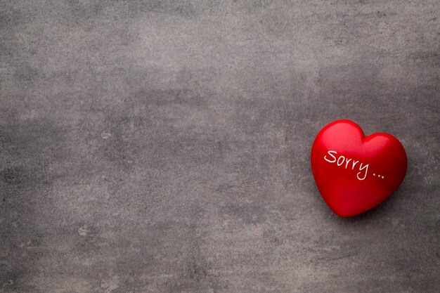 Valentine day. Red heart on the dark boards. Valentine's Day. Heart pendant. Red heart.