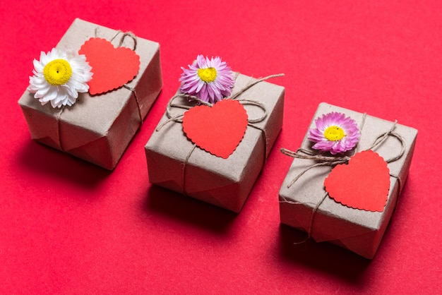 Valentine day three gift boxes on red background