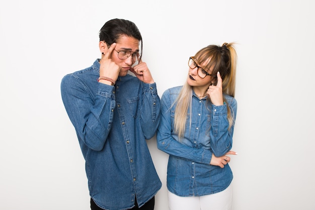 In valentine day Young couple with glasses having doubts and thinking