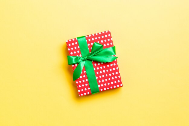 Valentine gift box on colored background, top view