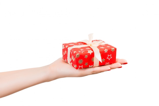 Valentine gift box with white bow on a hand