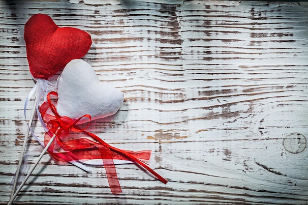 Valentine hearts with ribbons on wooden board holidays concept