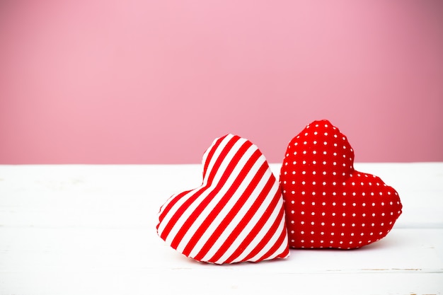 Valentine hearts on wooden background. Minimal concept.