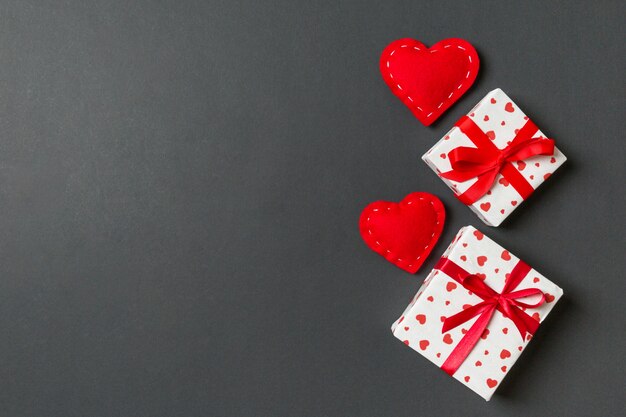 Valentine's composition of gift boxes and red textile hearts