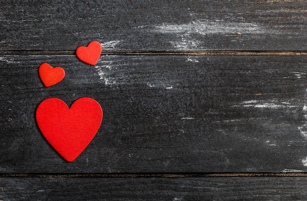 Valentine's Day background. Happy Valentine's day hearts on wooden table. Valentine card