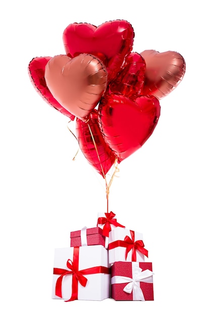 Valentine's day or birthday concept - gift boxes with red balloons isolated on white background