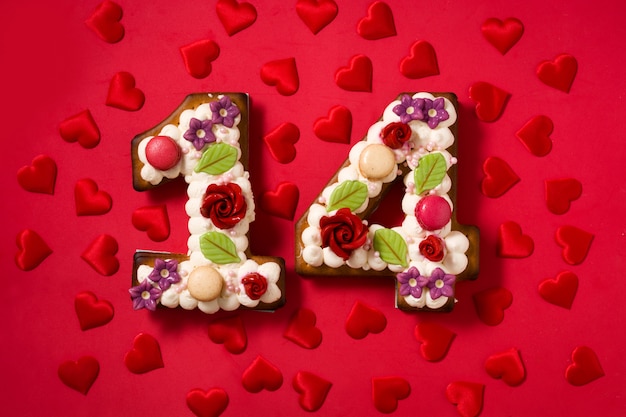 Photo valentine's day cake with number shape and hearts on red