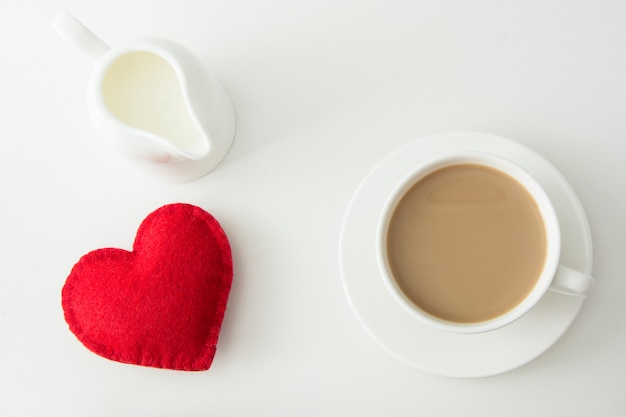 Valentine's day card. White cup of coffee with milk