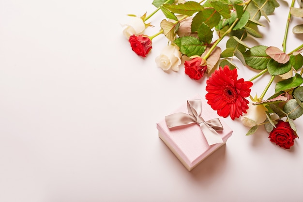 Valentine's day composition pink gift box with flowers. 