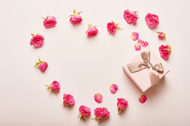 Valentine's day composition pink gift box with flowers. 