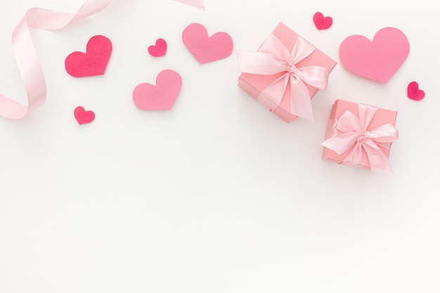 Valentine's day composition: two pink gift boxes with ribbon