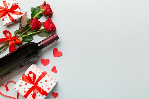 Valentine's day composition with red wine rose flower and gift box on table Top view flat lay Holiday concept