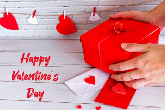 Valentine's day concept, hands holding gift.