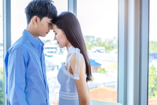 Valentine's day concept,portrait of asian Young happy couple face to face kissing at home background,copy space,Love story couple