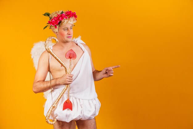 Valentine's day concept. Portrait of the God of love - Cupid with bow and arrow.