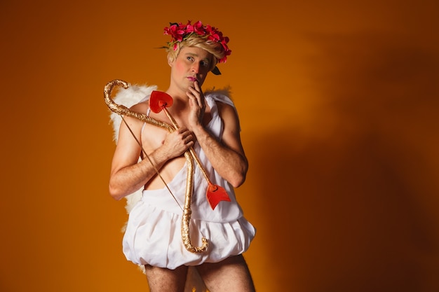 Valentine\'s day concept. portrait of the god of love - cupid\
with bow and arrow.