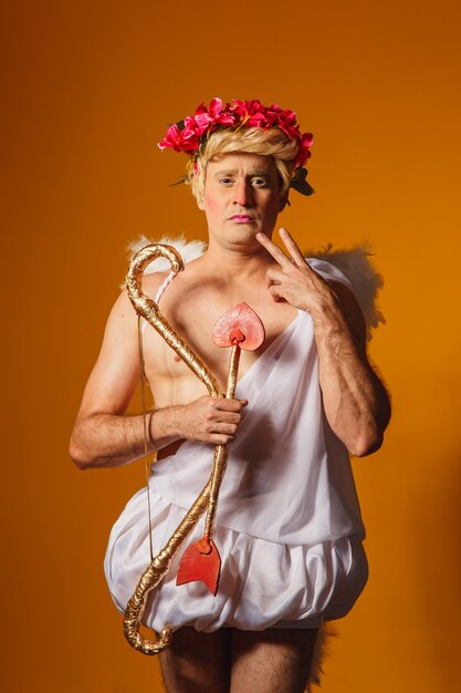 Valentine's day concept. Portrait of the God of love - Cupid with bow and arrow.