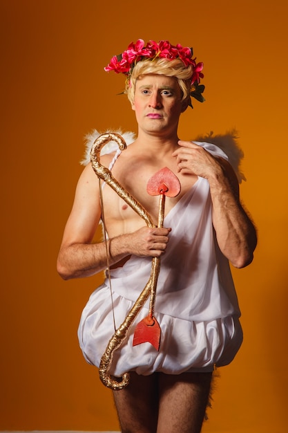 Valentine\'s day concept. portrait of the god of love - cupid\
with bow and arrow.