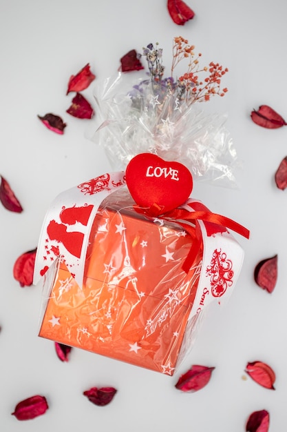 Valentine's day gift filled with chocolate on a white background