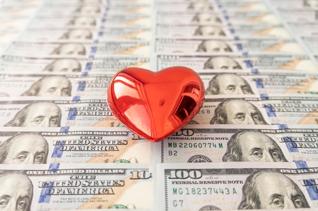 Valentine's day love of money Love and money concept Heart and American currency close up