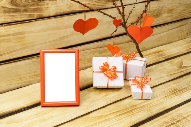 Valentine's Day photo frame on wooden surface