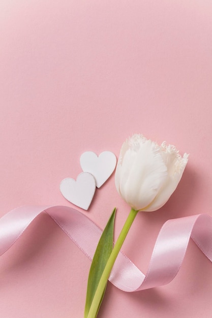 Valentine's day pink background flowers and hearts