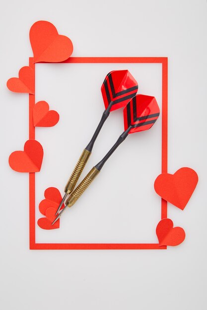 Valentine's day red darts and paper heart