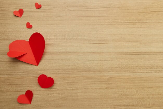 Valentine's day red paper heart on wooden