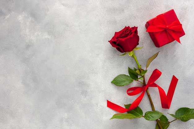 Valentine's Day. Red rose with a ribbon and red box.