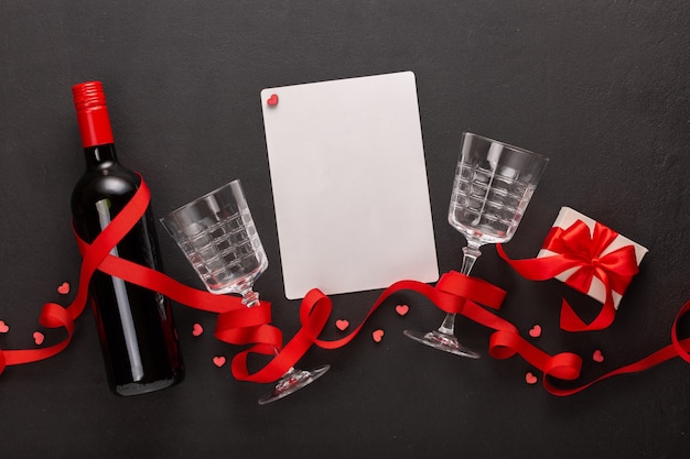 Valentine's day with wine and gift, blank sheet for text