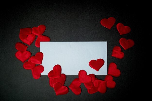 Valentine's daya Declaration of loveWhite envelope with red hearts Valentine On a dark gray background