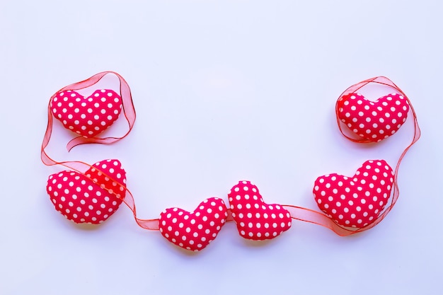 Valentine's hearts with ribbon on white background