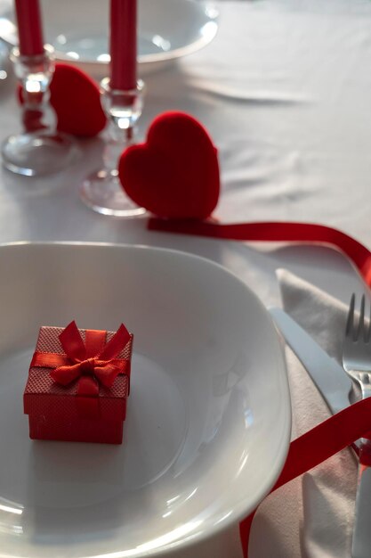 Valentine39s Day White Table with Gift and Red Hearts