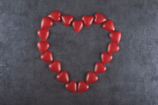 Photo valentineâs day background with red heart and gray background.