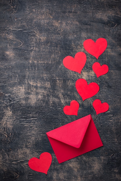 Valentines Day background with envelope and paper hearts