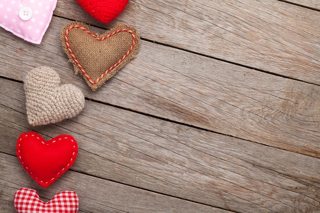 Valentines day background with handmade toy hearts