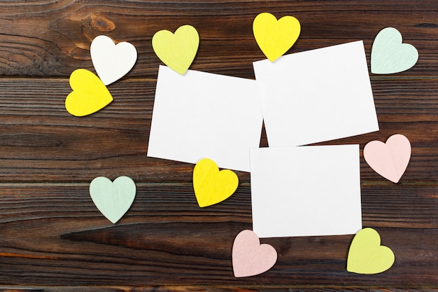 Valentines Day background with hearts on wooden background