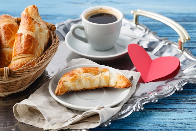 Valentines day breakfast with croissants and tea