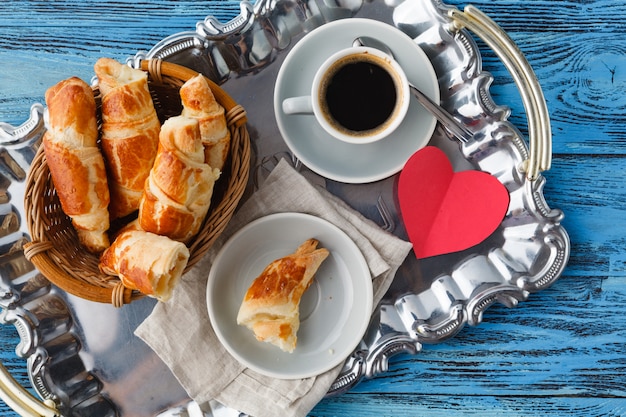 Valentines day breakfast with croissants and tea