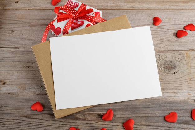 Valentines day card blank invitation stationery card mockup with envelope and red hearts and gifts