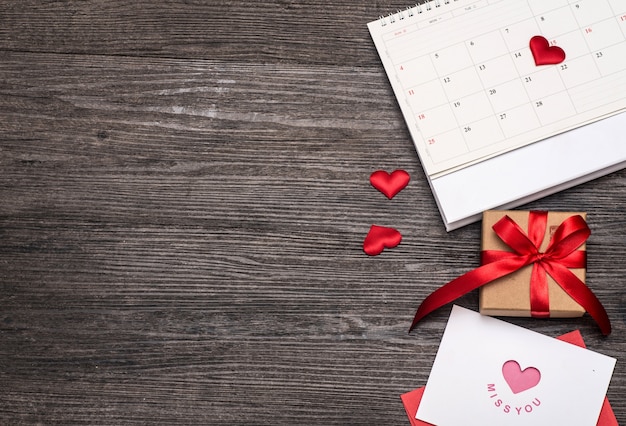 Valentines day card and gift on the old wooden board