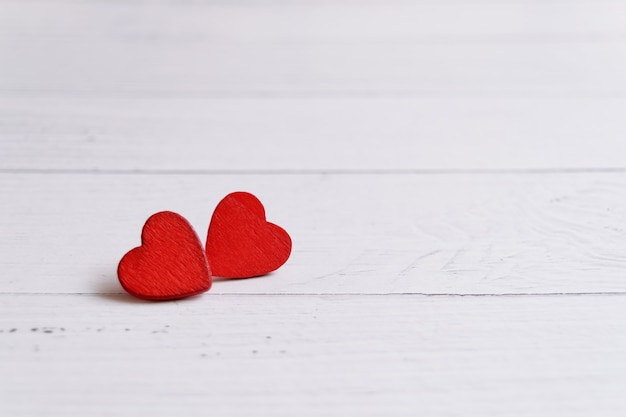 Valentines day card with hearts on a wooden background, love message