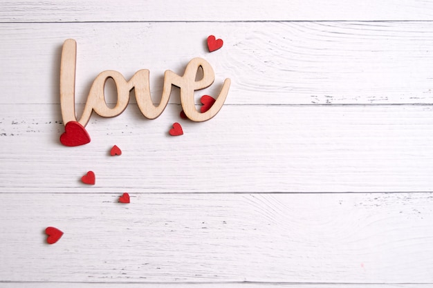 Valentines day card with red hearts on a wooden background, love message. Love concept. Romantic.