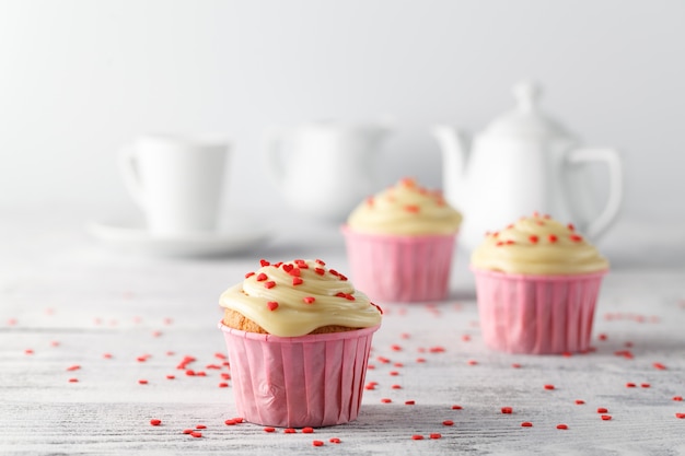 Valentines day coffee cup with cupcakes with hearts