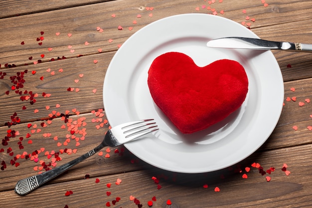 Valentines day composition on wooden table background