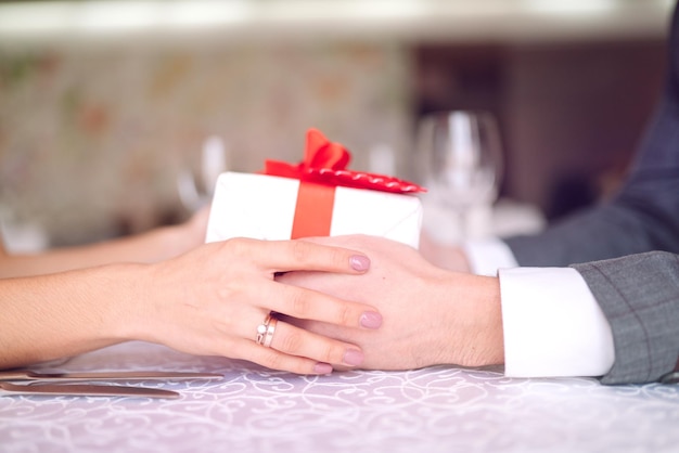 Valentines Day concept Happy couple in love Couple celebrating Valentines Day in the restaurant