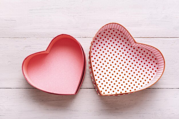 Valentines day concept. heart shaped gift boxes on a light wooden table