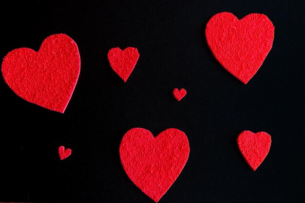 Valentines day concept hearts on black background