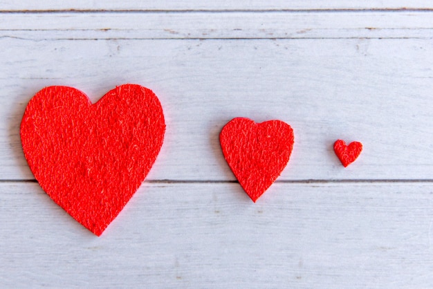 Valentines day concept hearts on wooden table